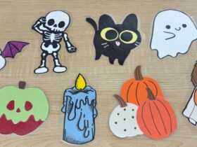 8 spooky scavenger hunt items. A bat, a skeleton, a black cat, a ghost, a poison apple, a melting wax candle, three pumpkins together, and a dog in costume.