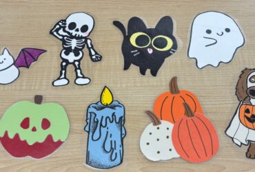 8 spooky scavenger hunt items. A bat, a skeleton, a black cat, a ghost, a poison apple, a melting wax candle, three pumpkins together, and a dog in costume.