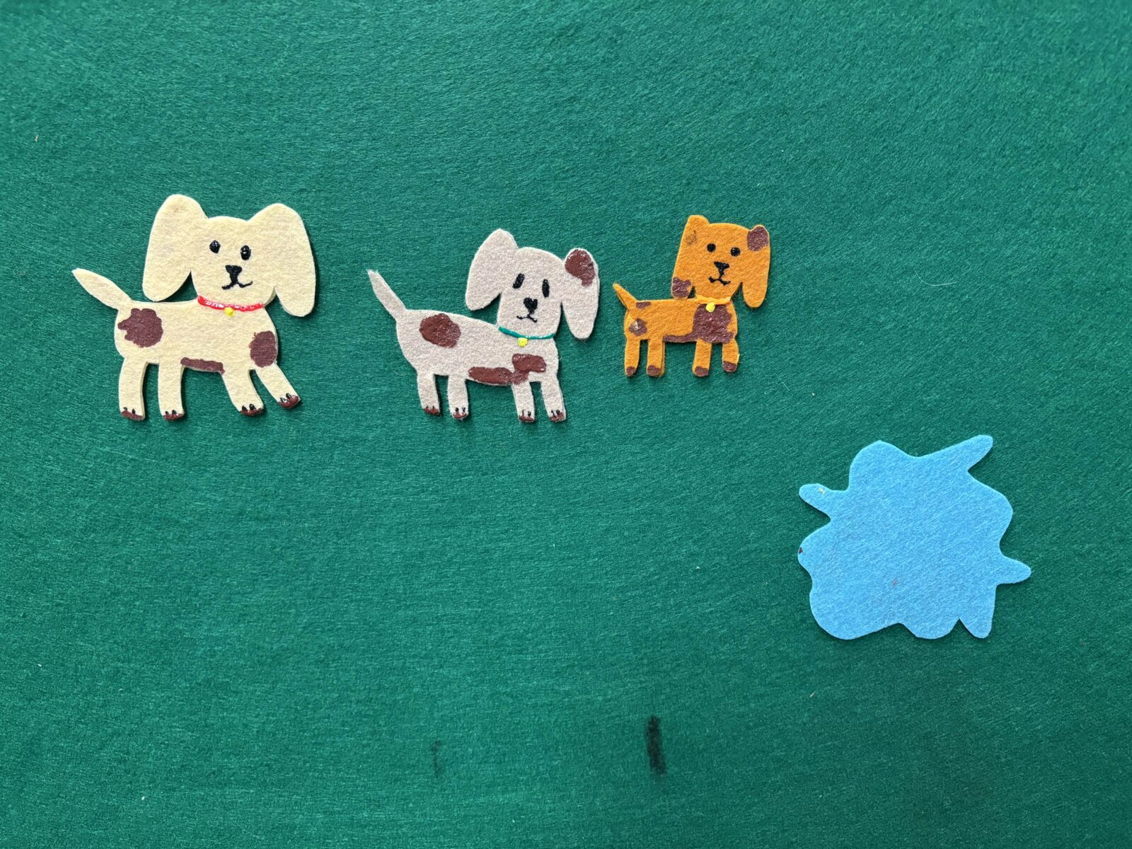 Felt dogs covered in Mud